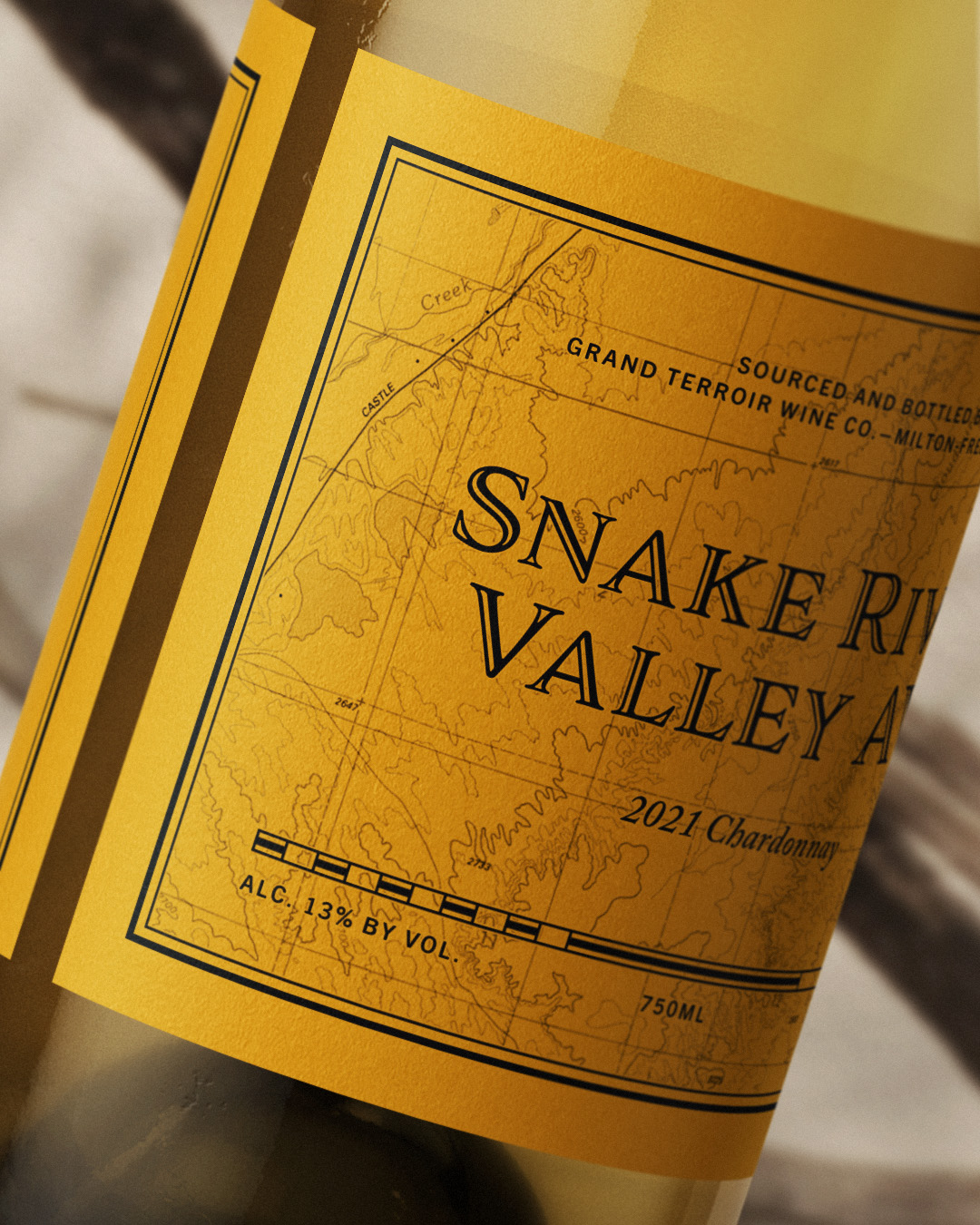 Ochre colored chardonnay wine label from the Snake River Valley AVA.