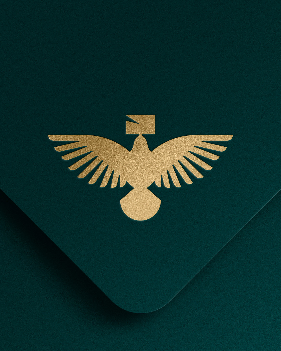 Dark teal envelope with golden carrier pigeon holding a letter.